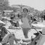 A woman with a parasol on the beach